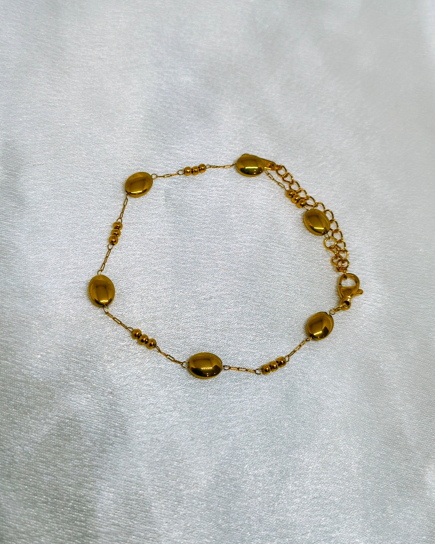 Dainty pebble charm bracelet