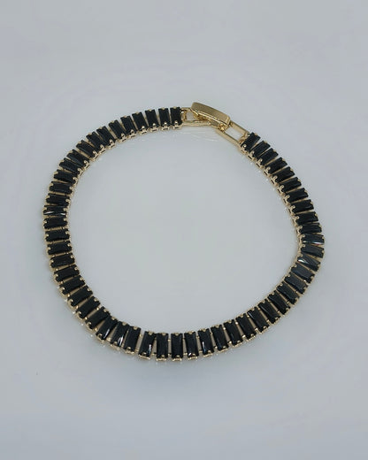 Black with gold color tone tennis bracelet
