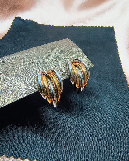 Dual tone swirl hoop earrings